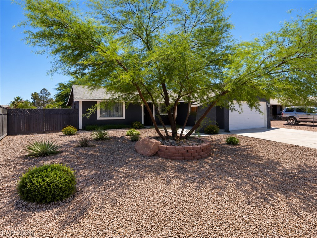 2870 South Sandhill Road Las Vegas, NV 89121 - Photo 11 of 64 A drought-tolerant landscape complements this home’s modern facade and integrated garage.