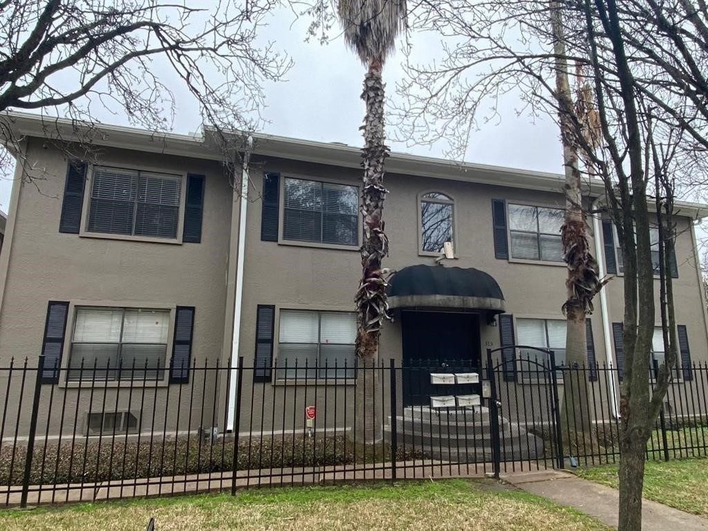 315 Branard Street, Unit 4 Houston, TX 77006 - Photo 1 of 20 a front view of a house with a yard