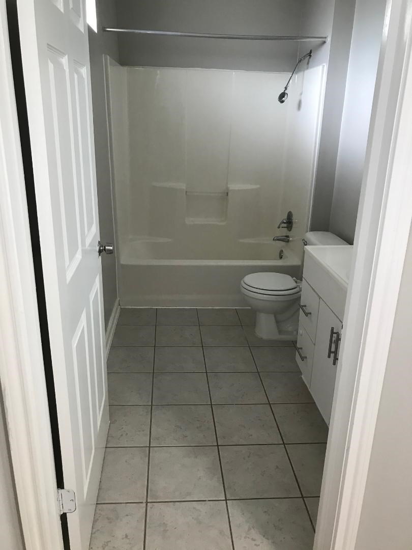 315 Branard Street, Unit 4 Houston, TX 77006 - Photo 11 of 20 a bathroom with a toilet and a shower