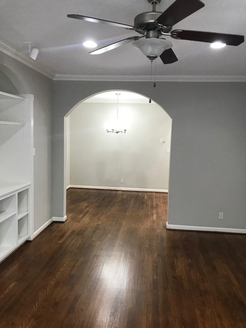 315 Branard Street, Unit 4 Houston, TX 77006 - Photo 7 of 20 an empty room with wooden floor and windows