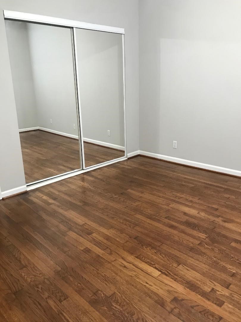 315 Branard Street, Unit 4 Houston, TX 77006 - Photo 9 of 20 a view of an empty room with wooden floor