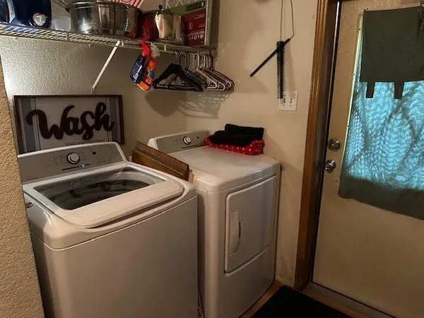 a utility room with dryer and washer