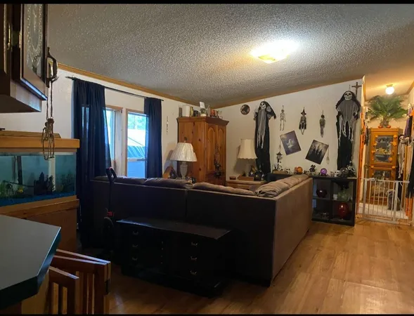 a view of living room with furniture and lamp
