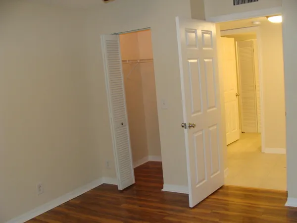 a view of a bathroom with wooden floor