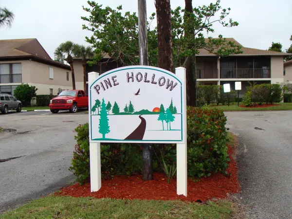 a view of a park that has a sign on the side of it
