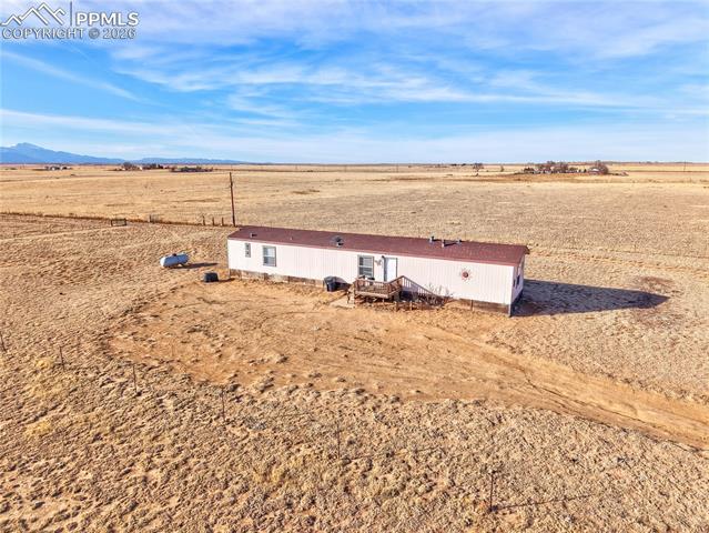 16830 Finch Road Colorado Springs, CO 80928 - Photo 24 of 49 1,244 square foot mobile home/ second home about 1/3 of the way back on the property with its own Pikes Peak views