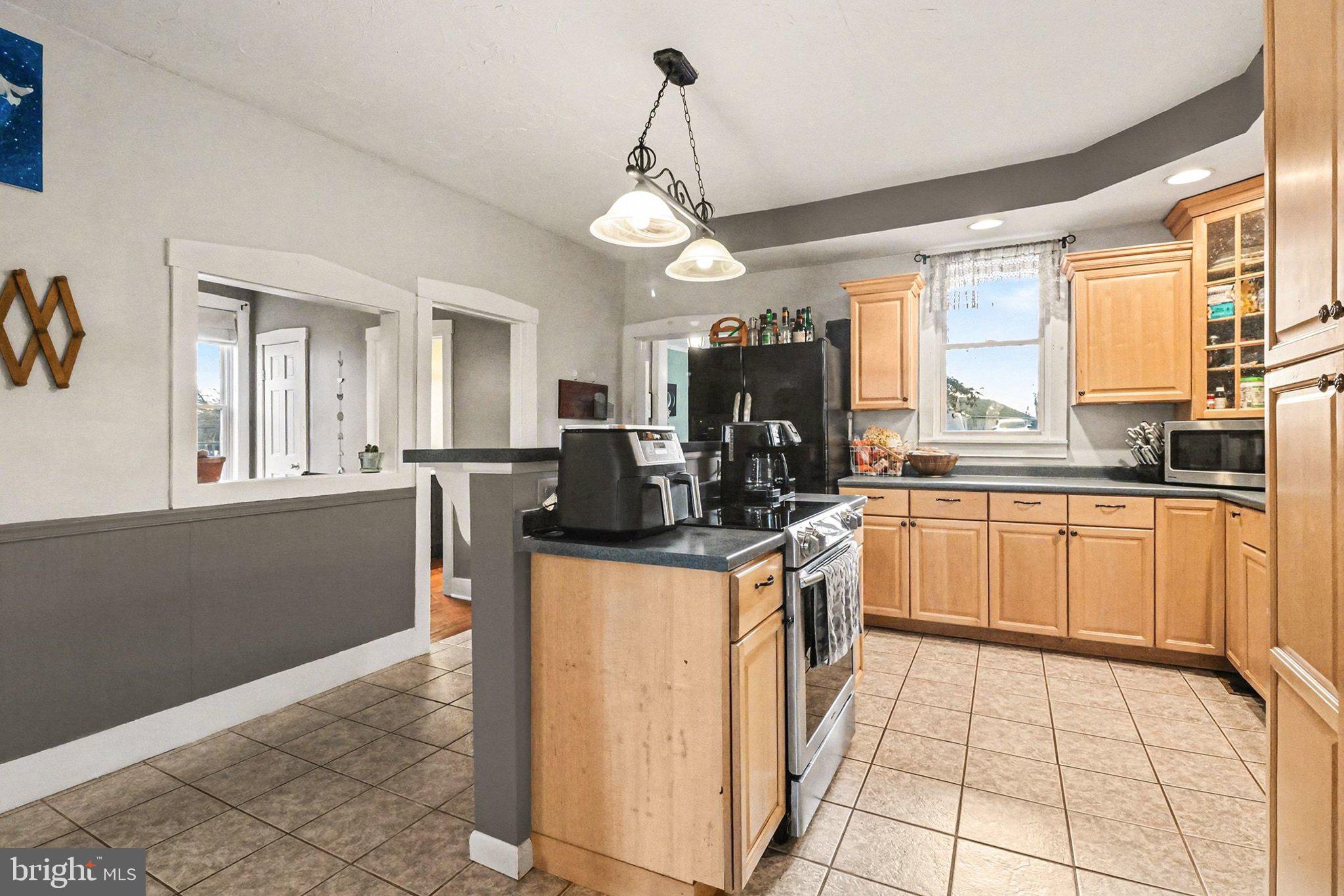 153 East Main Street Biglerville, PA 17307 - Photo 12 of 39 a kitchen with stainless steel appliances granite countertop a stove a sink dishwasher and a refrigerator