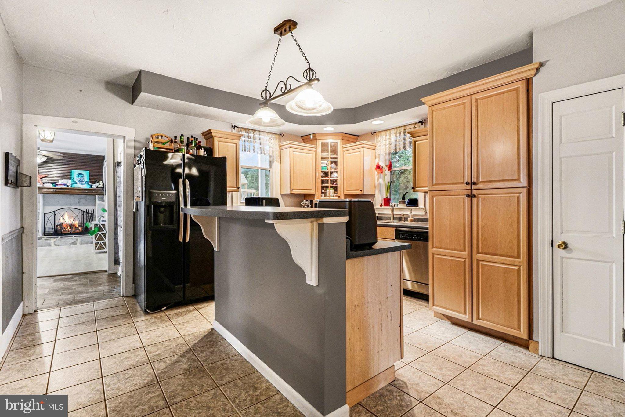 153 East Main Street Biglerville, PA 17307 - Photo 14 of 39 a kitchen with stainless steel appliances granite countertop a refrigerator and a stove