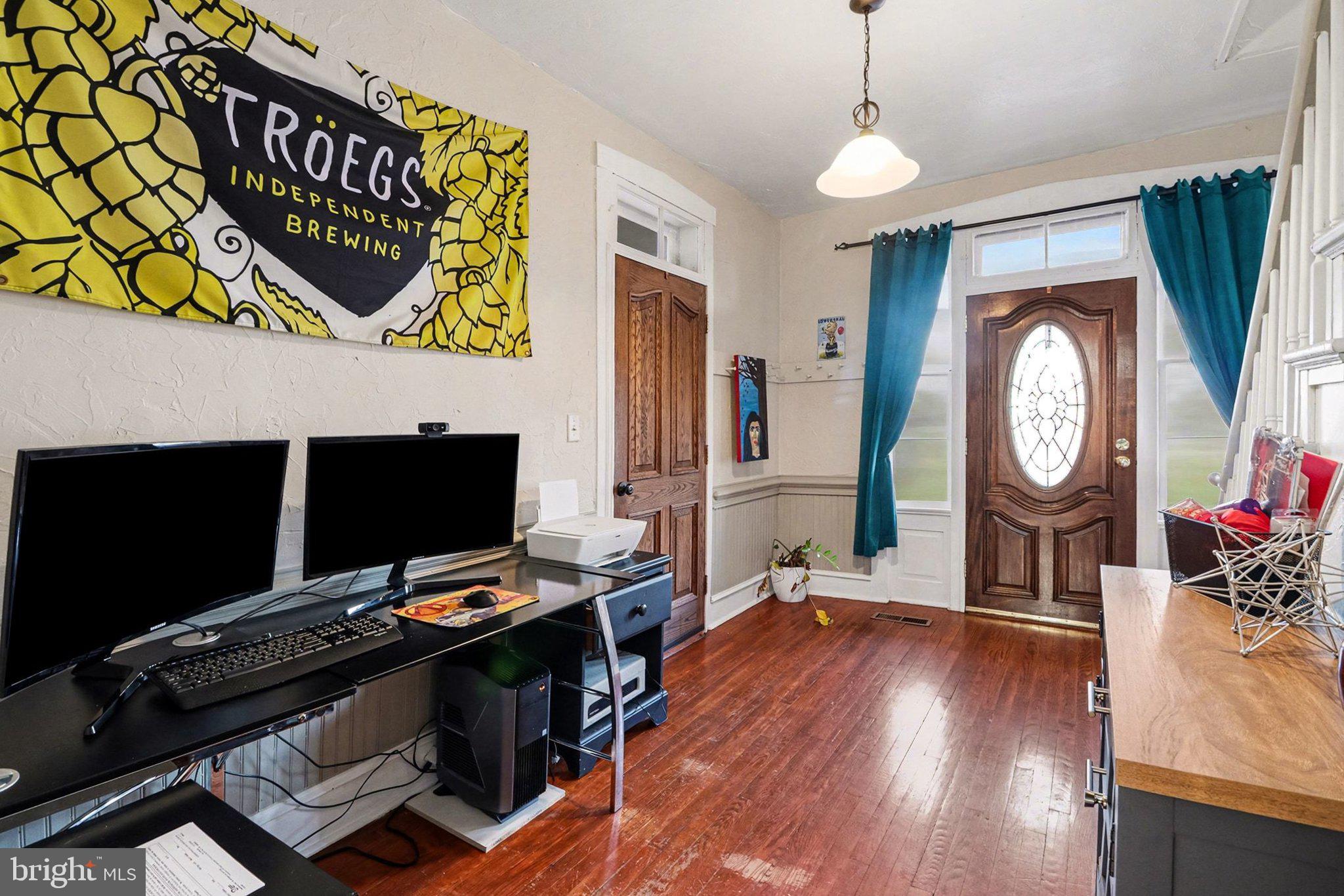 153 East Main Street Biglerville, PA 17307 - Photo 15 of 39 a view of a workspace with furniture and wooden floor