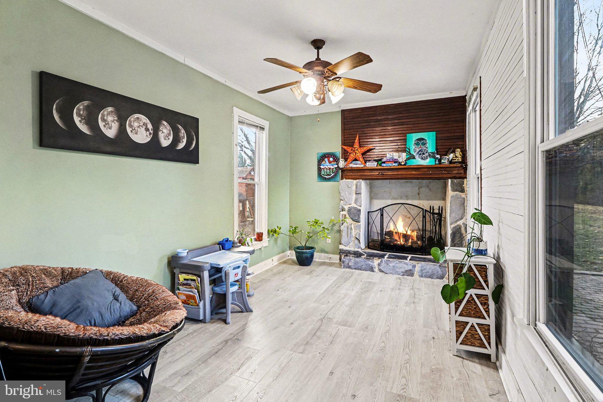153 East Main Street Biglerville, PA 17307 - Photo 16 of 39 a living room with furniture and a fireplace