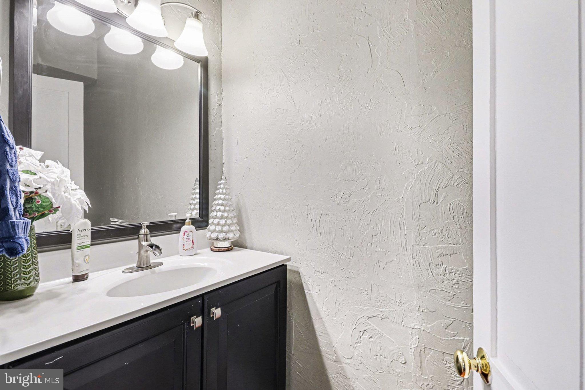 153 East Main Street Biglerville, PA 17307 - Photo 18 of 39 a bathroom with a sink and a mirror
