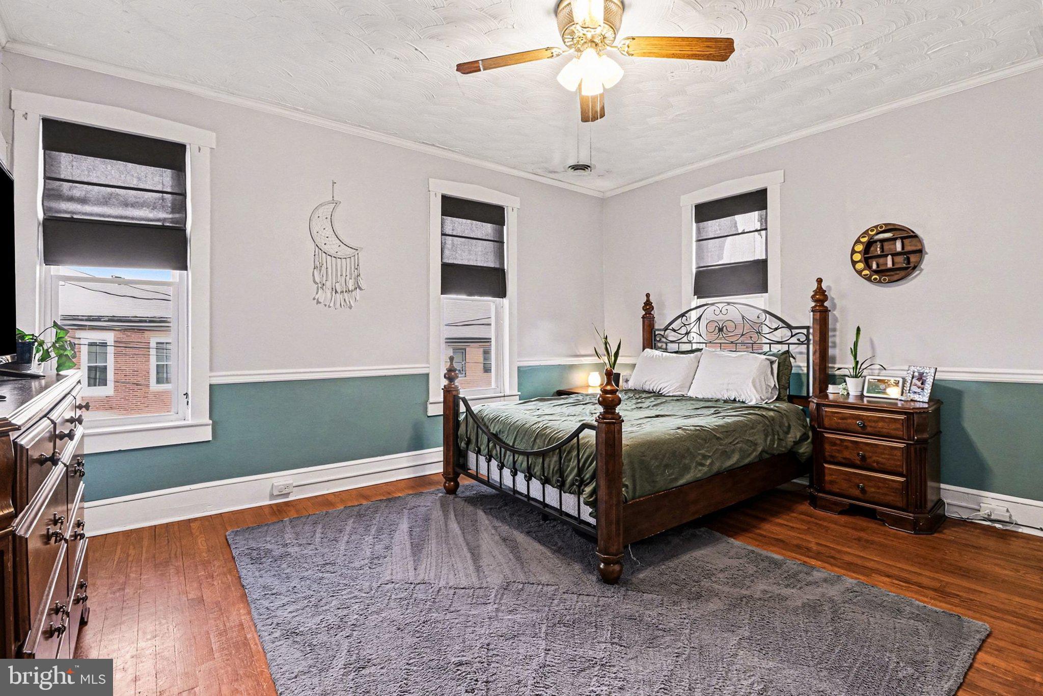 153 East Main Street Biglerville, PA 17307 - Photo 20 of 39 a bedroom with a bed and a chandelier