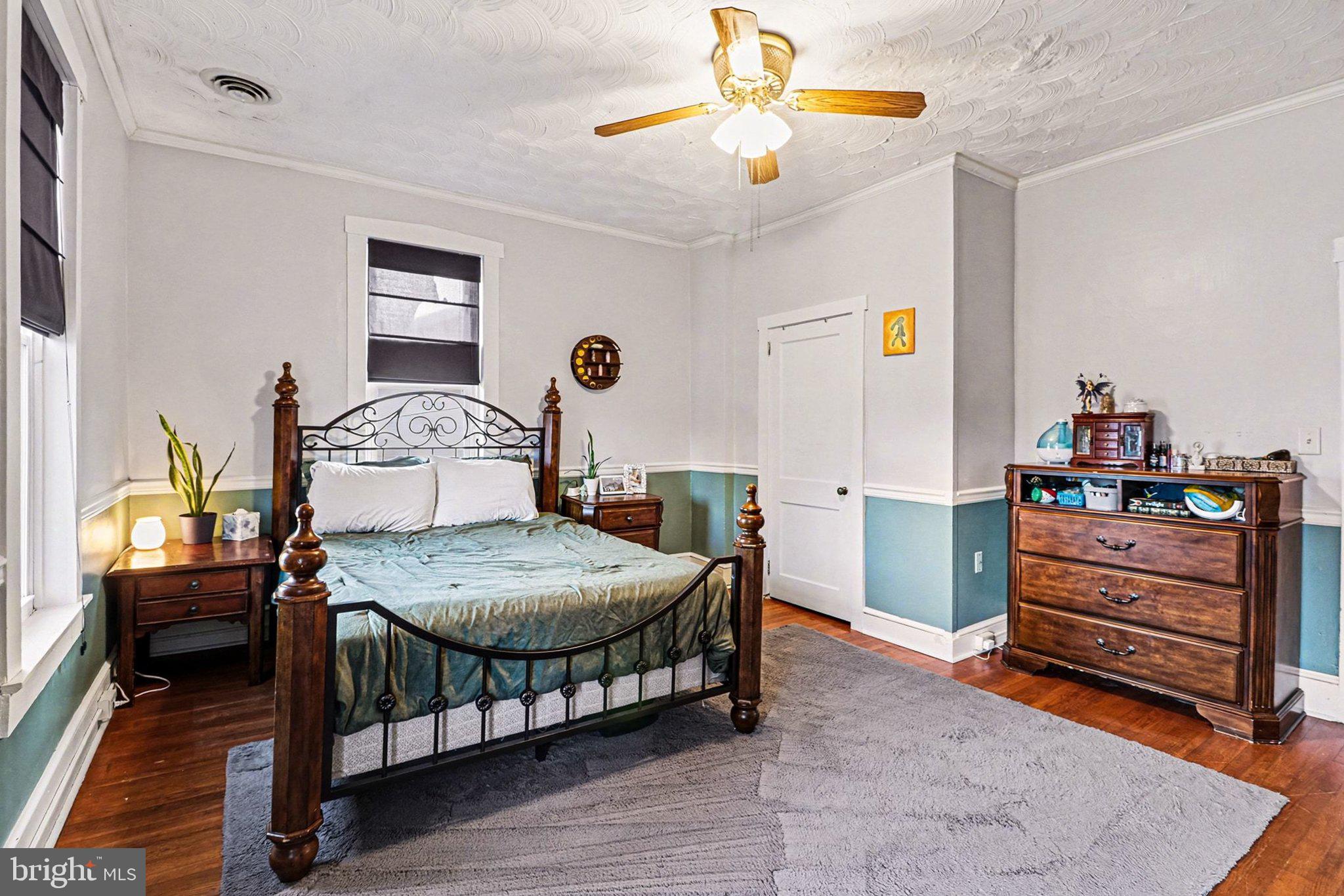 153 East Main Street Biglerville, PA 17307 - Photo 21 of 39 a bedroom with a bed and wooden floor