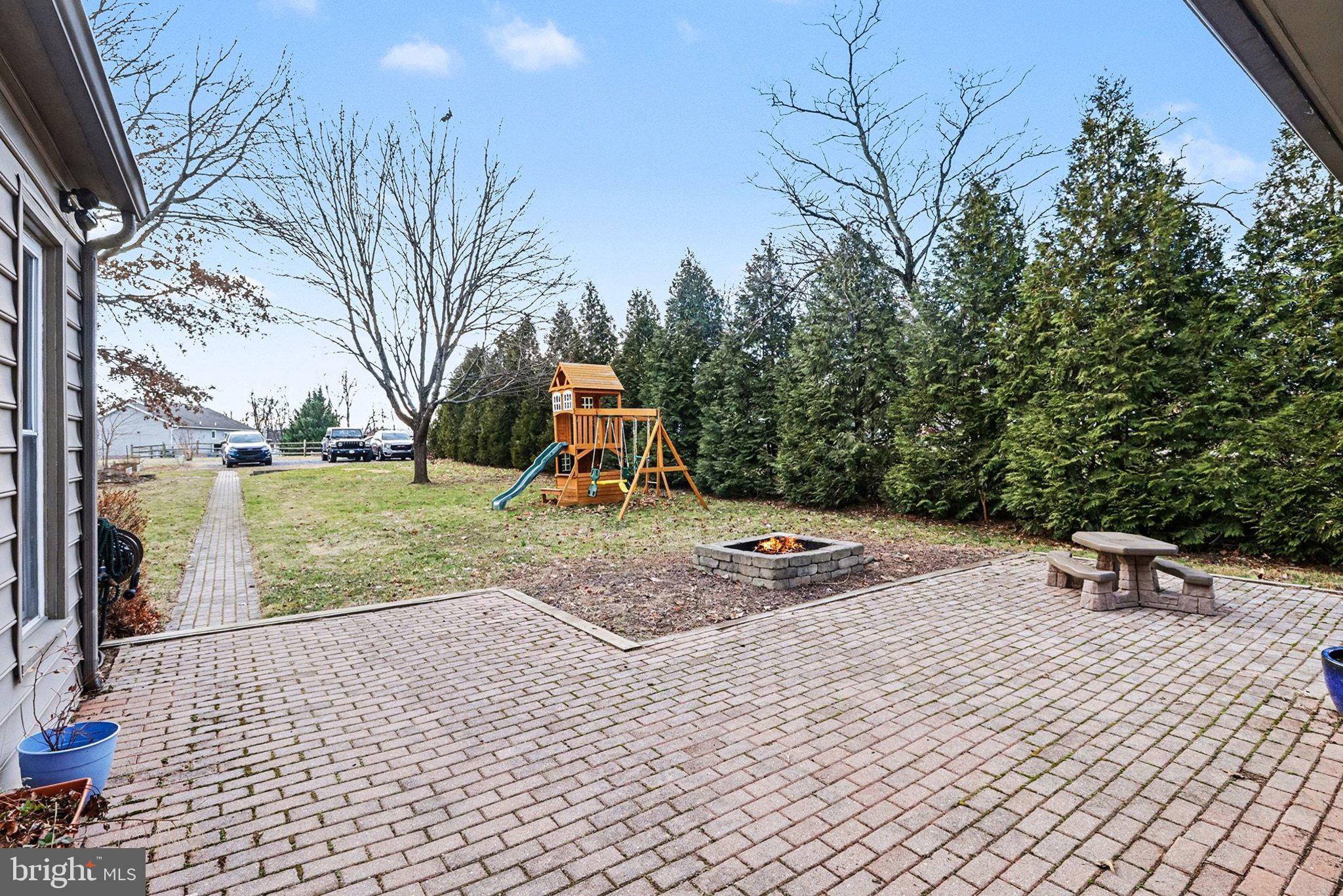 153 East Main Street Biglerville, PA 17307 - Photo 31 of 39 a view of a park with swings and slides