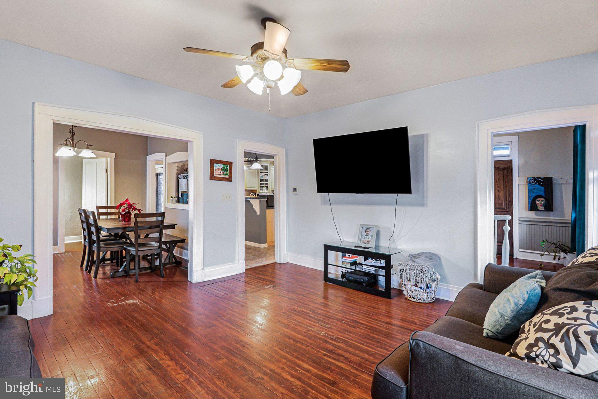 153 East Main Street Biglerville, PA 17307 - Photo 8 of 39 a living room with furniture and a flat screen tv