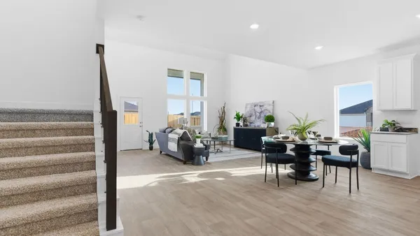 a view of a livingroom with furniture and wooden floor