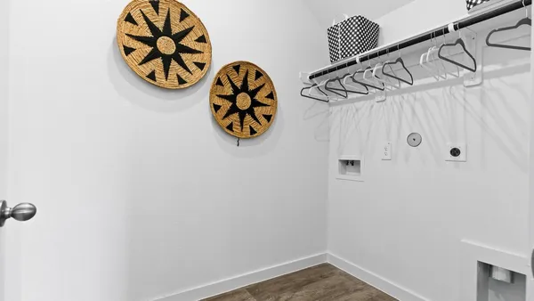 a view of a room with rack on the wall and wall paintings