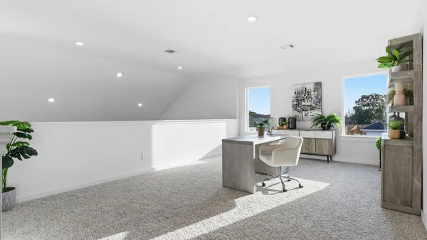 a living room with furniture a dining table and a potted plant