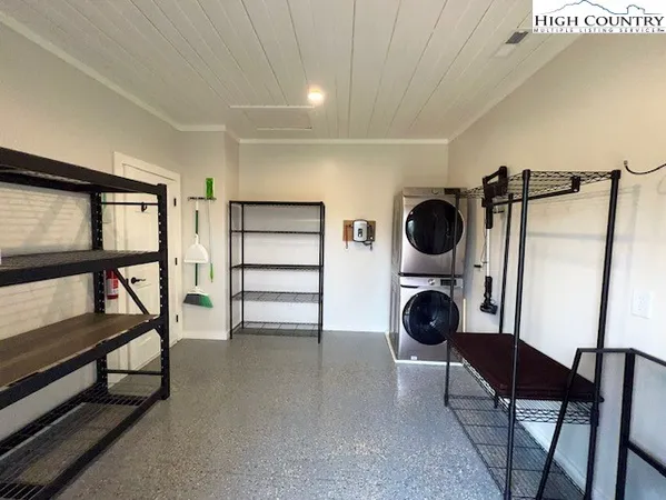 a view of a hallway with washer and dryer