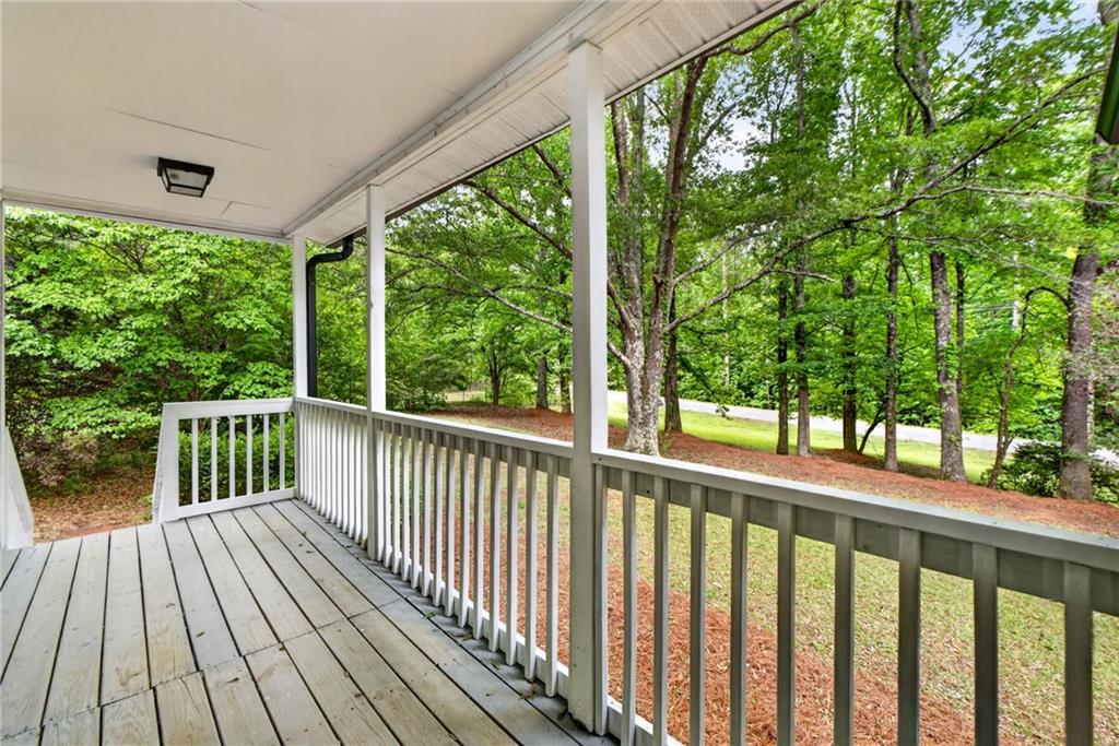 7630 Rico Road Palmetto, GA 30268 - Photo 11 of 53 a view of balcony with wooden floor