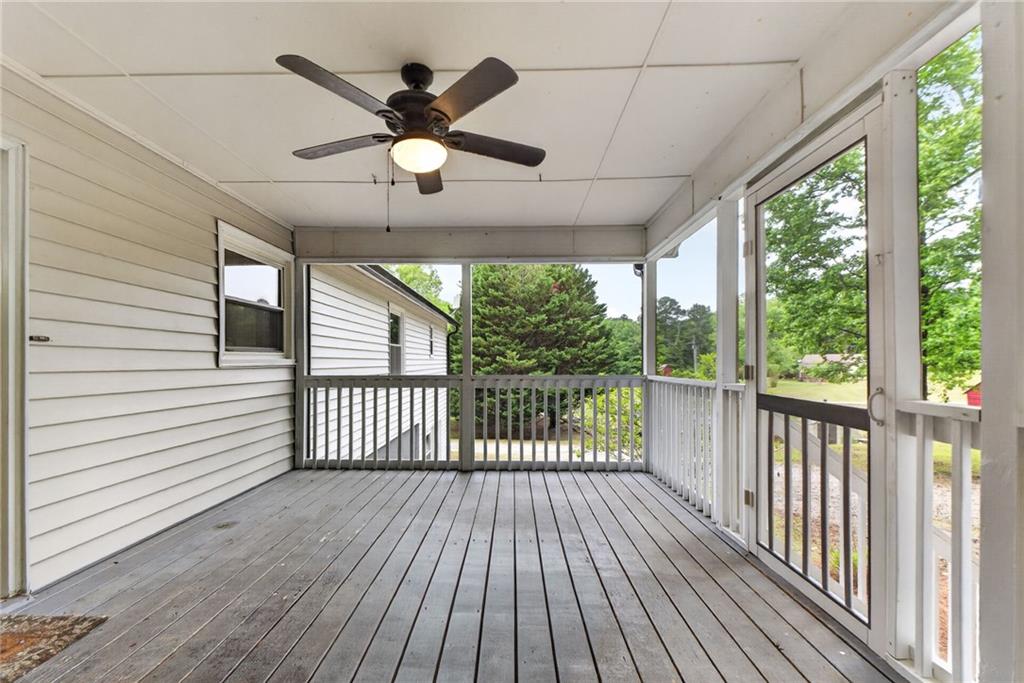 7630 Rico Road Palmetto, GA 30268 - Photo 21 of 53 a view of a porch with wooden floor