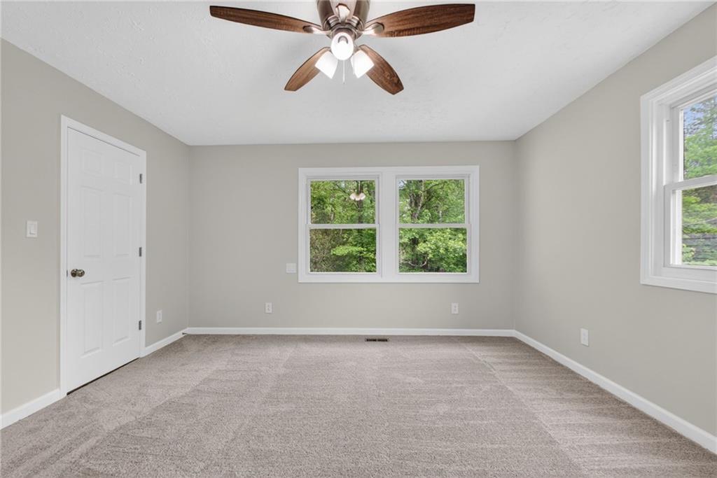 7630 Rico Road Palmetto, GA 30268 - Photo 28 of 53 an empty room with a window and a fan