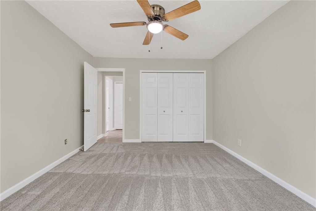 7630 Rico Road Palmetto, GA 30268 - Photo 30 of 53 wooden floor in an empty room