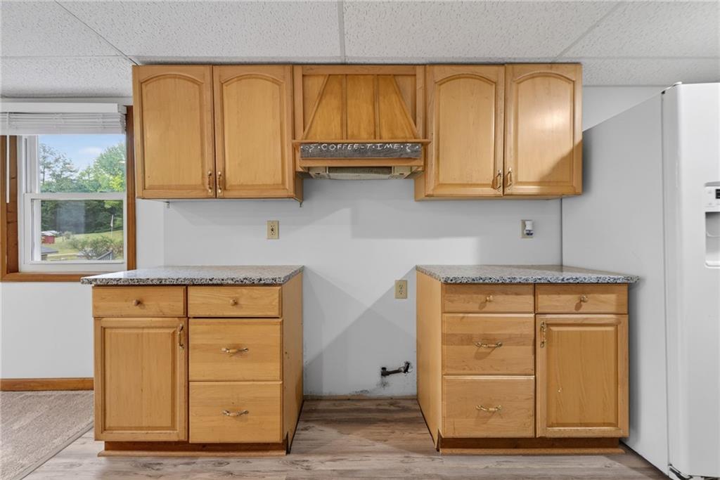 7630 Rico Road Palmetto, GA 30268 - Photo 35 of 53 a kitchen with granite countertop cabinets and window