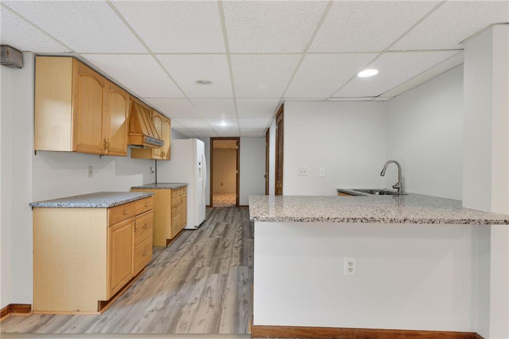 7630 Rico Road Palmetto, GA 30268 - Photo 37 of 53 a large kitchen with stainless steel appliances granite countertop a sink a stove counter space and cabinets