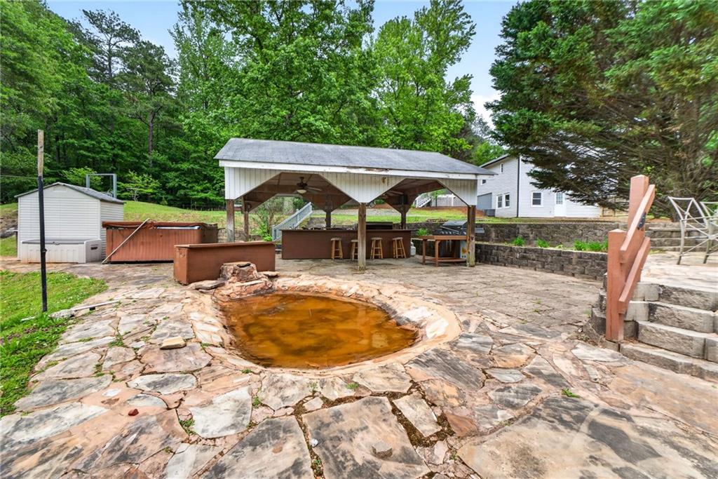 7630 Rico Road Palmetto, GA 30268 - Photo 7 of 53 a view of a swimming pool with a patio