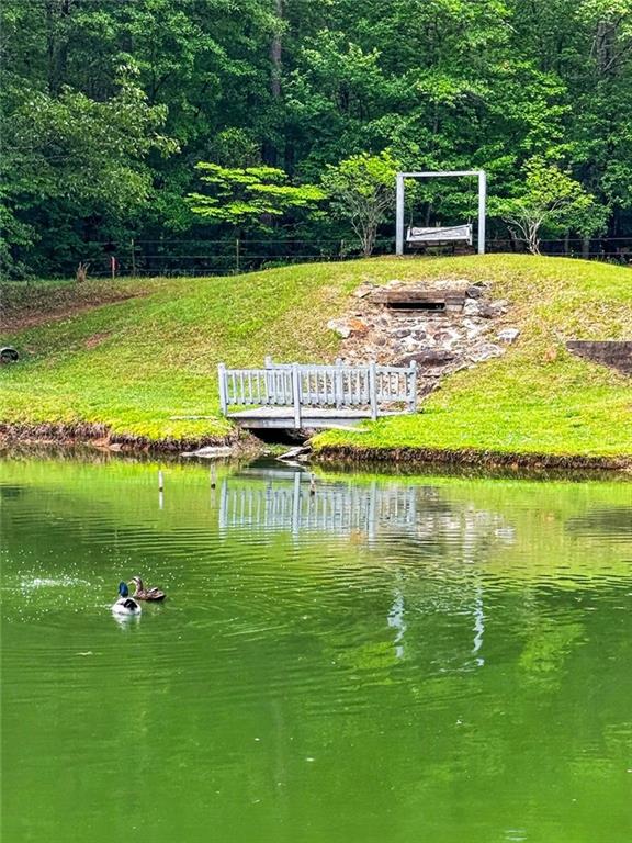 7630 Rico Road Palmetto, GA 30268 - Photo 10 of 53 a view of a lake with a big yard