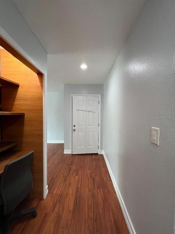 157 Springwood Circle, Unit C Longwood, FL 32750 - Photo 14 of 26 a view of a livingroom with wooden floor and a fireplace