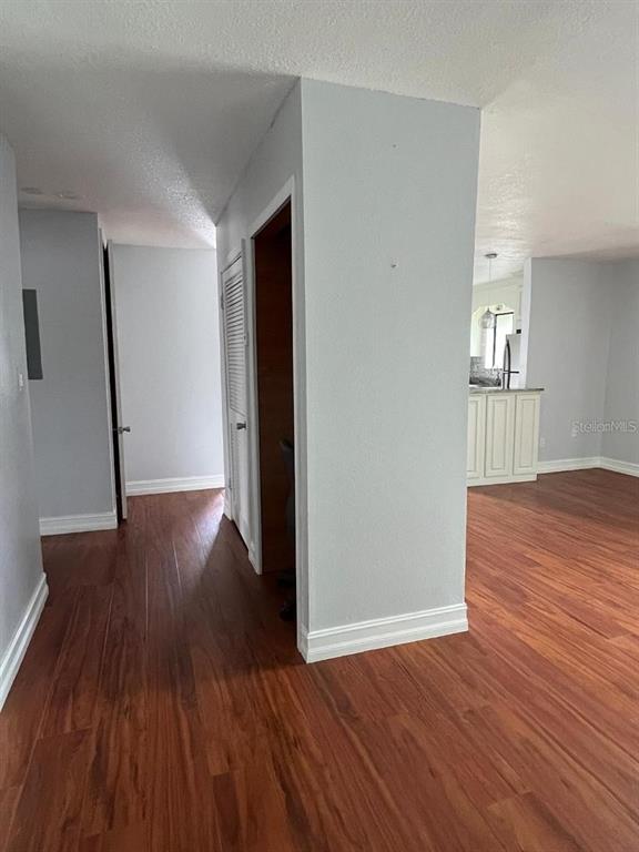 157 Springwood Circle, Unit C Longwood, FL 32750 - Photo 18 of 26 wooden floor in an empty room with a window