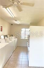 157 Springwood Circle, Unit C Longwood, FL 32750 - Photo 23 of 26 a bathroom with a sink mirror and a bath tub