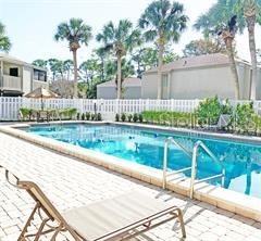 157 Springwood Circle, Unit C Longwood, FL 32750 - Photo 26 of 26 a garden view with a bench in patio