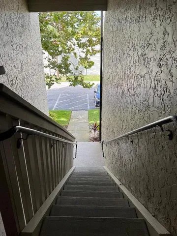 a view of balcony with wooden floor