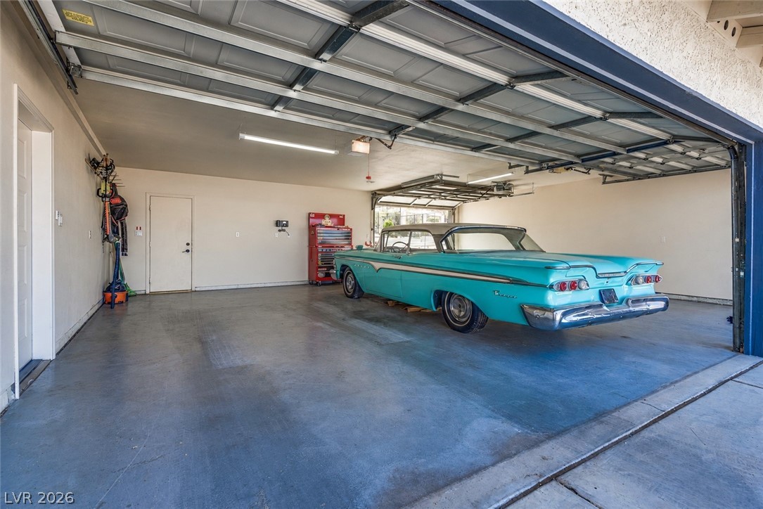 524 Swallow Cove Boulder City, NV 89005 - Photo 38 of 58 Secure parking space with a garage door opener and ample room for storage and vehicles.