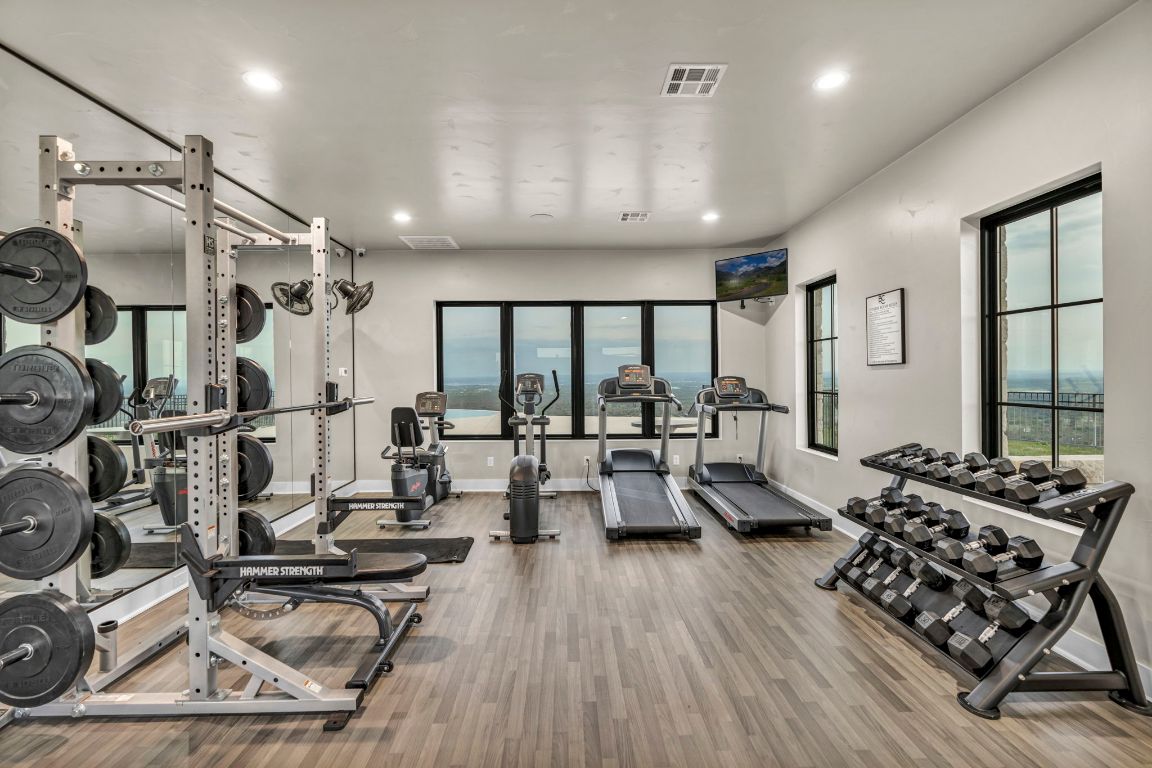 Lot 34 High Range Drive Kingsland, TX 78639 - Photo 10 of 15 a living room with furniture hard wood floor and a floor to ceiling window