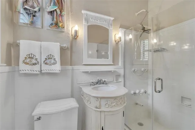 a spacious bathroom with a tub sink and mirror
