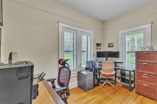 a bathroom with a double vanity sink mirror and shower