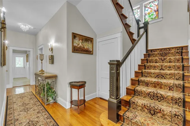 a view of a bathroom with mirror and door