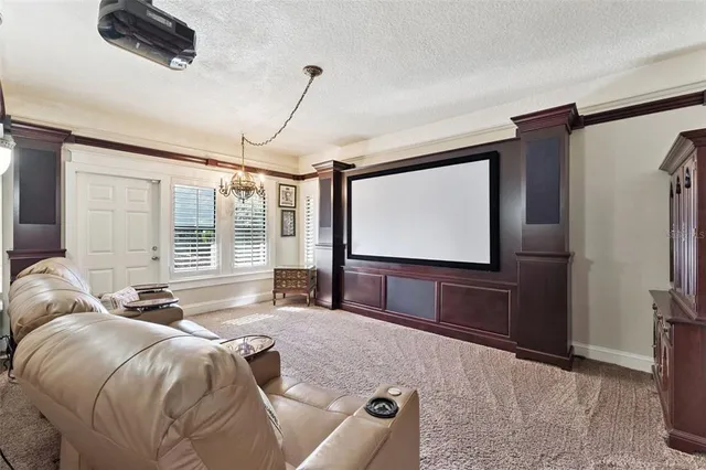 a kitchen with stainless steel appliances granite countertop a refrigerator a stove a sink dishwasher and white cabinets with wooden floor