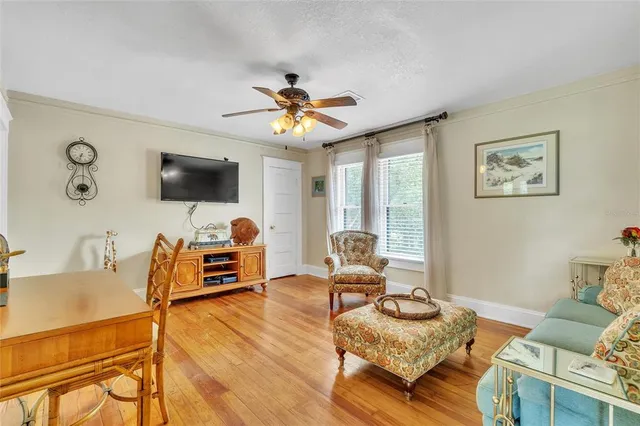 a view of a room with wooden floor