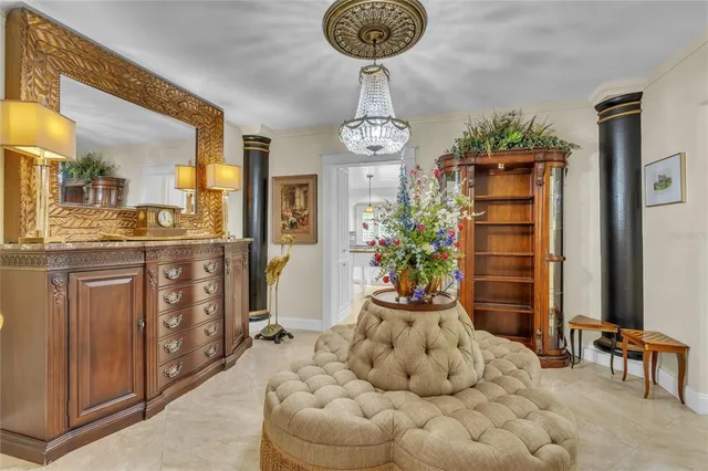 a living room with furniture a piano and a flat screen tv