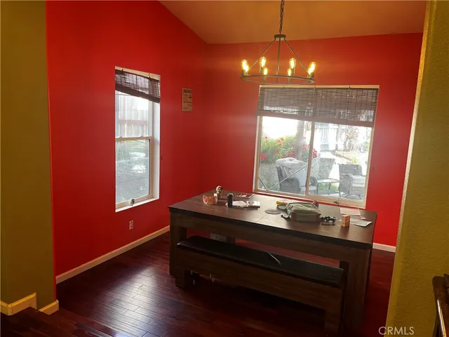 a room with wooden floor and window