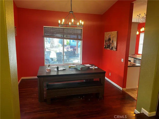 a room with furniture and wooden floor