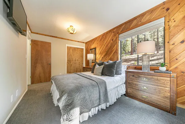 a bed room with a bed and a window