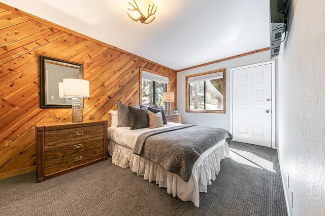 a bathroom with a double vanity sink and mirror