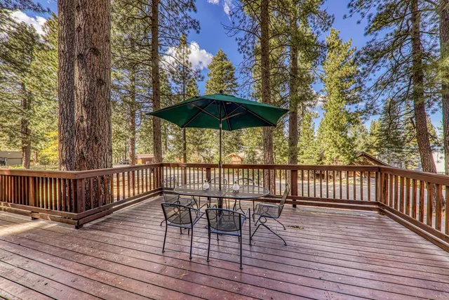 a view of deck with barbeque grill and wooden floor