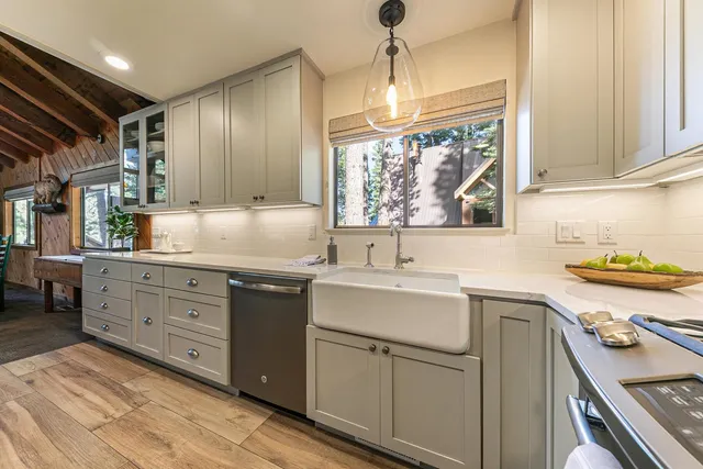 a kitchen with sink cabinets and window